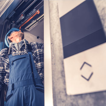 Man working on elevator
