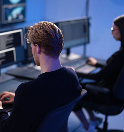 Man working in workplace on computer