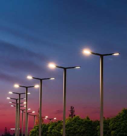 Street lights with sunset in the background