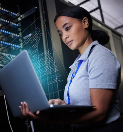 Women working on computer with coding floating