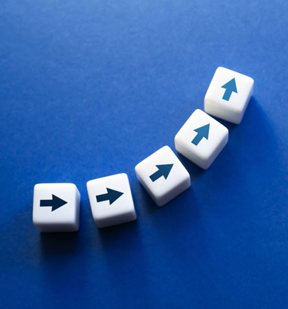 Dice with arrows going up