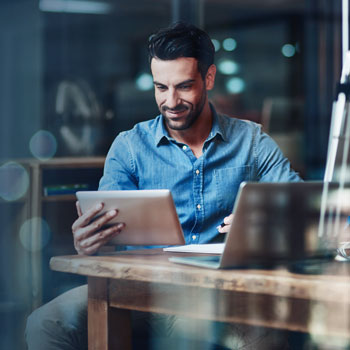 man looking at tablet