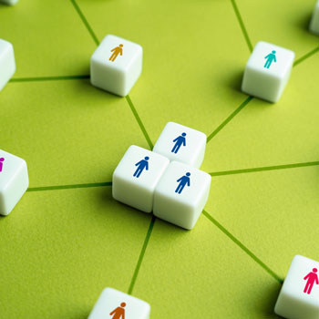 different colored dice with outline of person on it