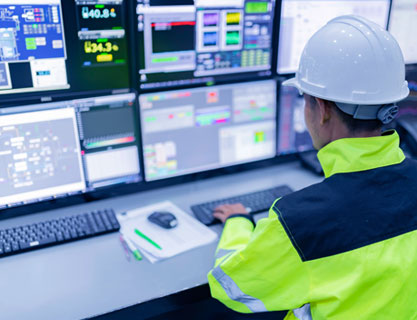 Man typing on computer with data